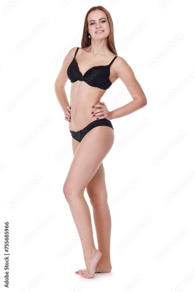 Beautiful smiling girl in underwear poses isolated on white background