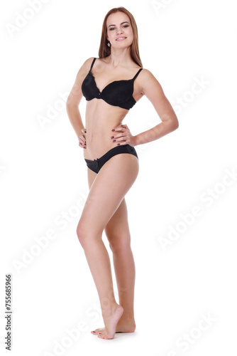 Beautiful smiling girl in underwear poses isolated on white background