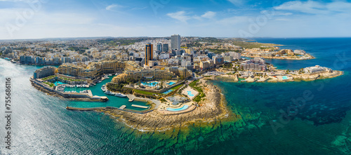 Landscape panorama of f St. Julian's city, modern high buildings. Day. Maltese island, Mediterranean sea
