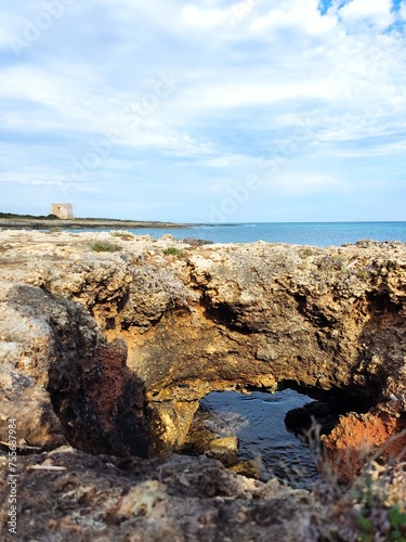 Coastal Sentinel: Torre Pozzelle Overlooking the Azure Waters of Apulia, Italy photo