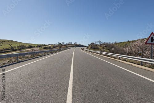 A two-lane road with one lane in each direction with a solid white line in the middle © Toyakisfoto.photos