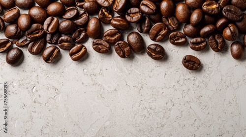 Close-up of oily dark-brown coffee beans piled in a random pattern on a white background. Well-lit with shallow depth of field, highlighting the rich texture and color of the beans.