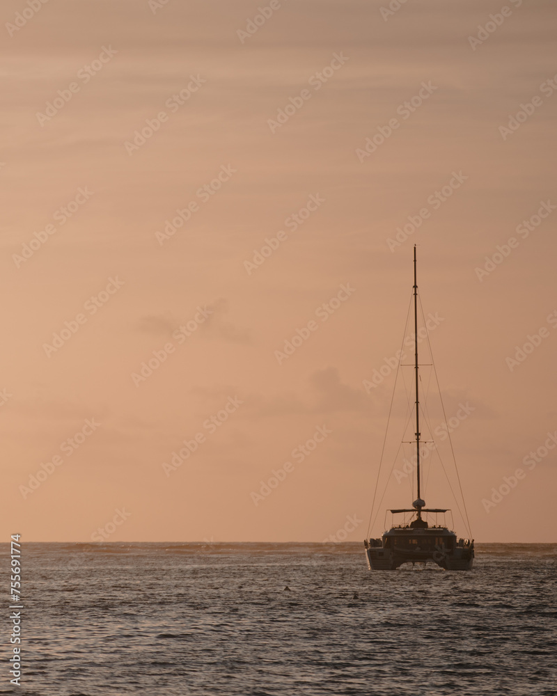 A Boat Silhouetted against the Stunning Sunset at SXM
