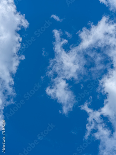 fluffy clouds and blue sky background