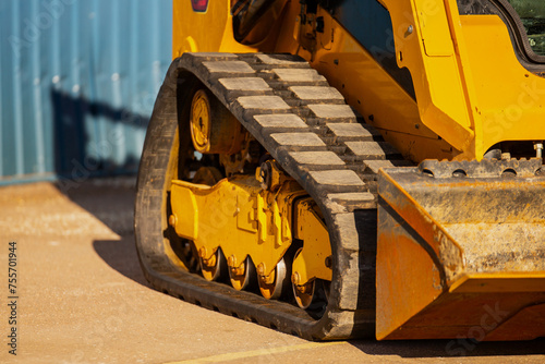 Schilderij op canvas Industrial compact skid steer loader rubber tracks close up of construction equi