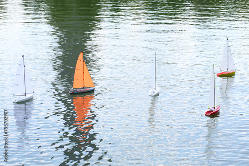 Five radio-controlled boat on water, close-up photo