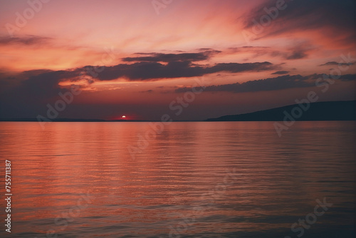 Serene Sunset Over Tranquil Waters With Vivid Sky Reflecting in the Calm Sea