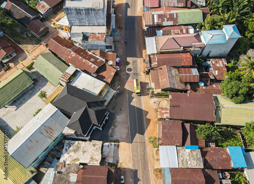 The center of a settlement in a small town, on the edge of a cross-regional road, in East Kotawaringin Regency, Central Kalimantan, Indonesia, seen from an aerial view.