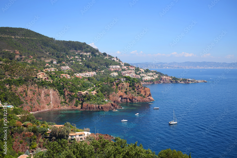 Cityscape with many vessels near shore in Cannes, France at summer sunny day