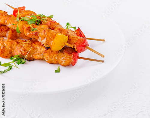 Chicken skewers with slices of sweet peppers