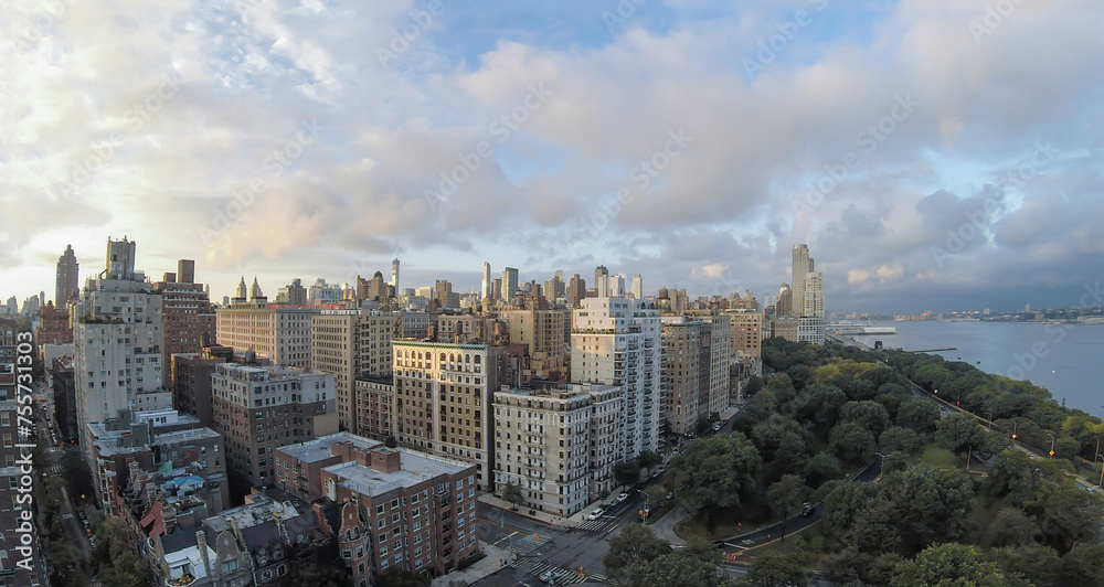 Cityscape with Riverside Park at summer evening. Aerial panorama