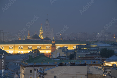 Part of Arsenal building, roofs and Spasskaya Tower with illimination at night in Moscow, Russia