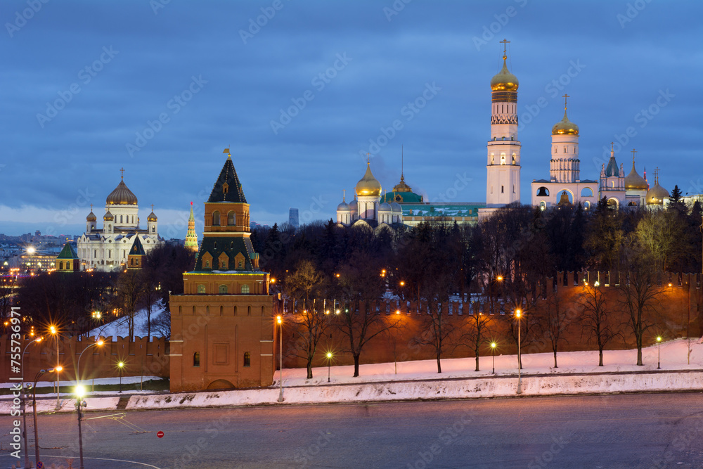 Bell tower of Ivan Great, Kremlin wall and Cathedral of Christ Saviour at evening in Moscow