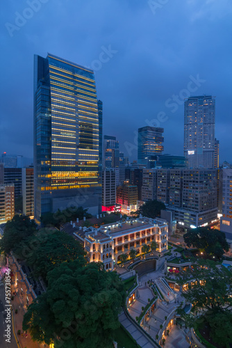 Skyscrapers and tall buildings in business area at evening in Hong Kong, China, view from Starhouse photo