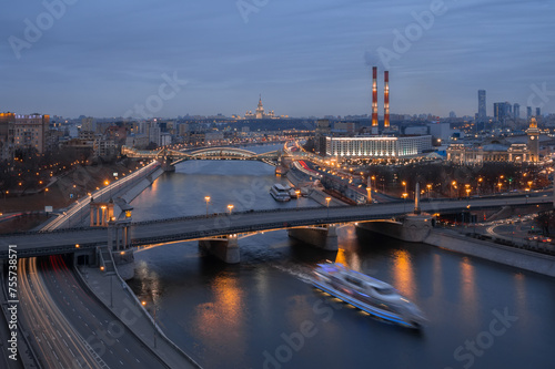 Borodinsky Bridge  river  factory pipes and panorama of city in Moscow  Russia at evening