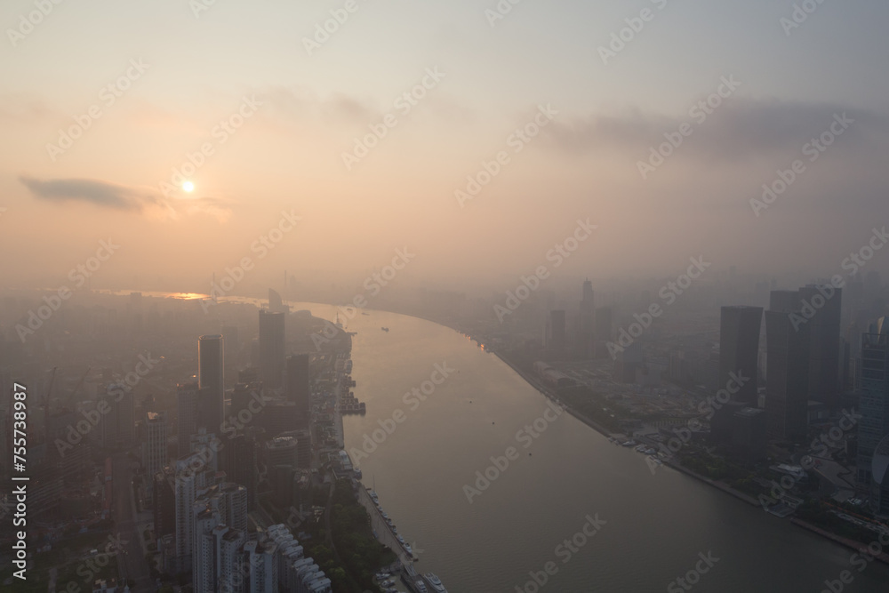 Shanghai in fog and sunrise at early morning, view from White Magnolia Plaza Shanghai in fog and sunrise at early morning, view from White Magnolia Plaza