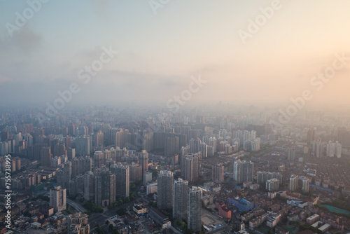 Shanghai in fog at early morning during sunrise, view from White Magnolia Plaza