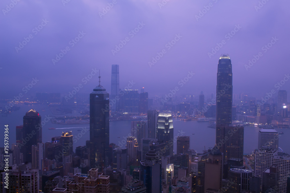 Night view of city in fog and Victoria Harbour in Hong Kong, China, view from Queen Garden