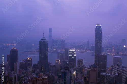 Night view of city in fog and Victoria Harbour in Hong Kong  China  view from Queen Garden