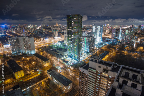 Night view of residential district with illumiantion and cloudy sky in Moscow, Russia © Pavel Losevsky