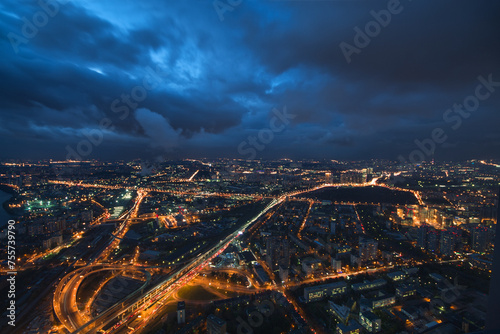 Highways, tall buildings at night and storm clouds in Moscow, Russia