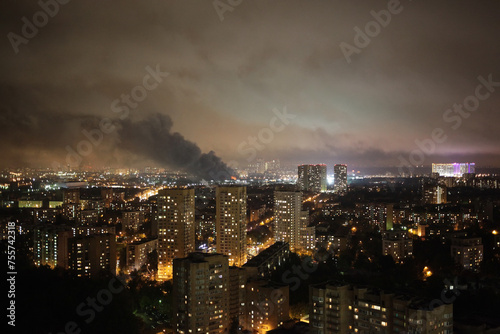 Smoke and fire in residential area in Moscow at autumn night