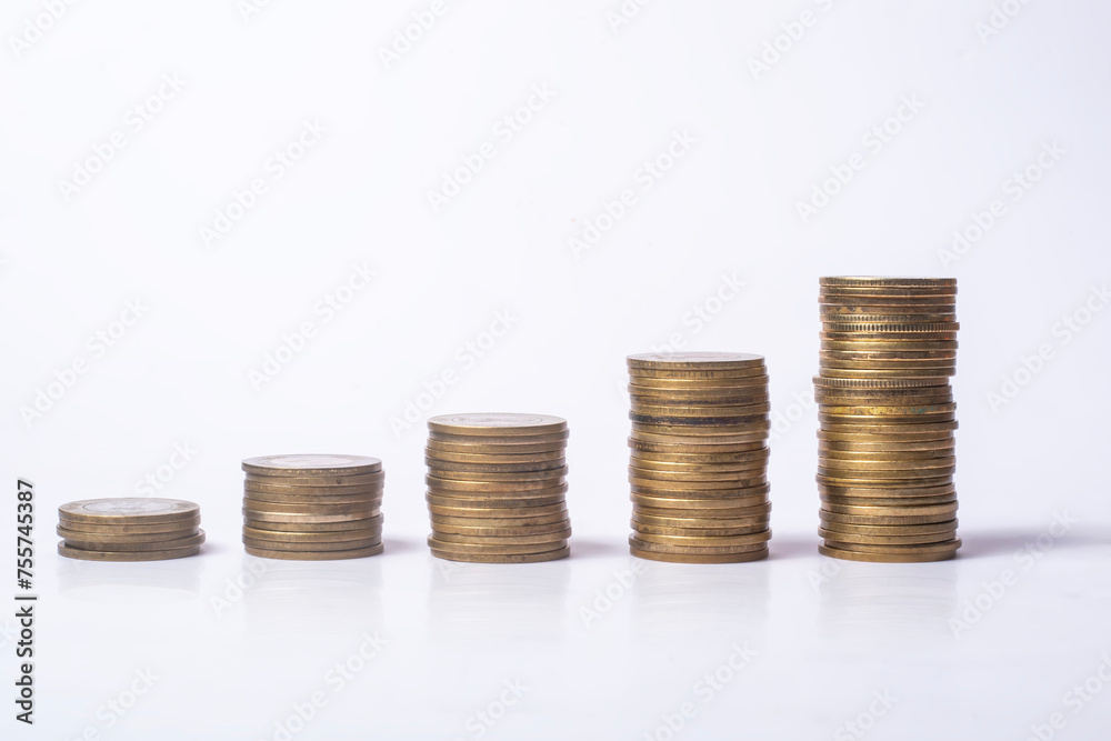 Stacks of coins isolated on white background, business and finance concept Stacks of coins isolated on white background, business and finance concept