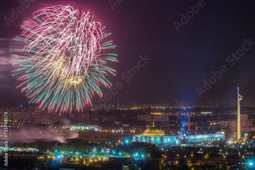Bright fireworks explosions in night sky above Victory Park in Moscow, Russia