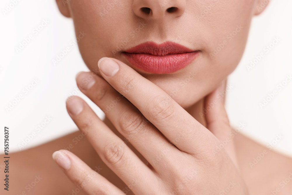 Obraz premium Woman with beautiful lips on white background, closeup
