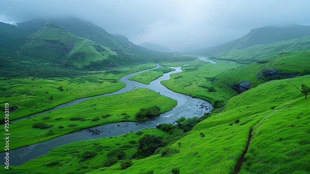Scenic view of a river flowing through a beautiful green valley