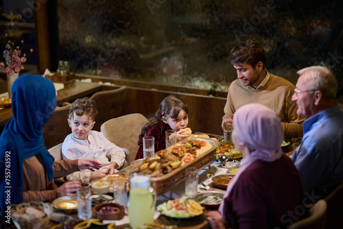 A modern and traditional European Islamic family comes together for iftar in a contemporary restaurant during the Ramadan fasting period  embodying cultural harmony and familial unity amidst a