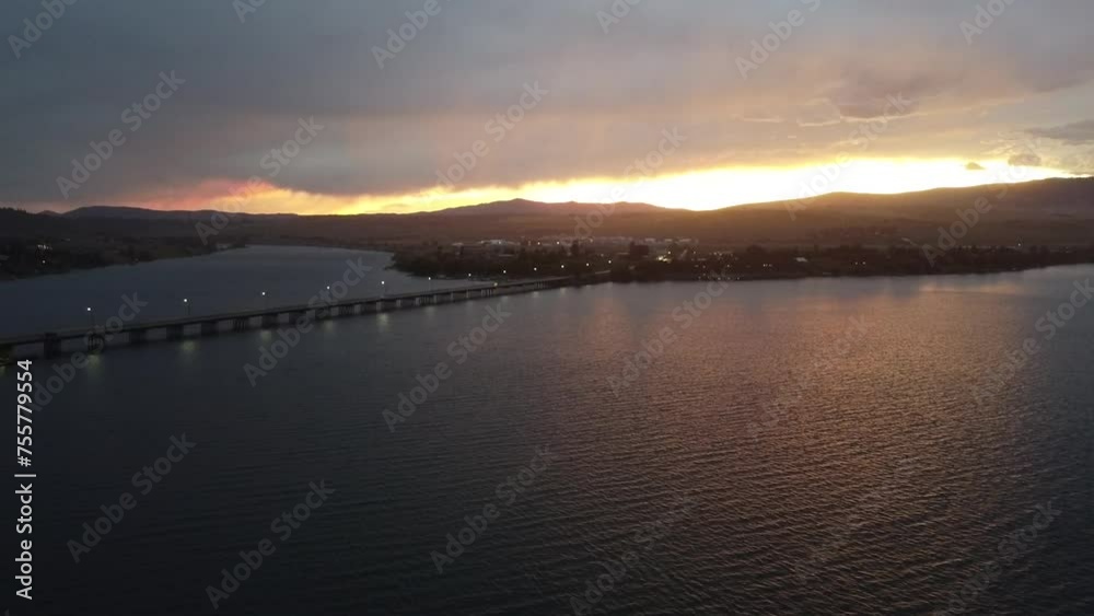 View with a drone over the Flathead lake, in Polson, Montana, during a cloudy sunset, in August.