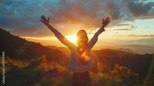 woman arms raised up in success on sunset,sihouette style