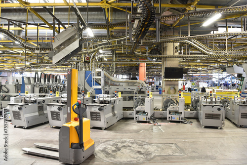 modern machines for transportation in a large print shop for production of newspapers & magazines