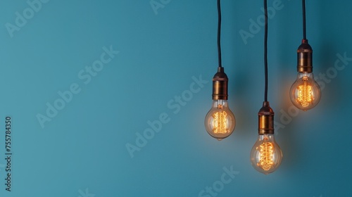 Incandescent lamp idea concept on blue wall background, copy space. generative AI image