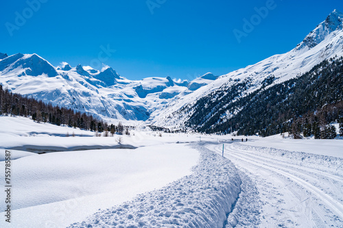 Val Roseg, in Engadine, Switzerland, in winter, with snow-covered cross-country ski slopes. © leledaniele