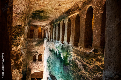 Arches of subterranean monolithic church of Saint-Jean carved into a cliff, largest underground church in Europe. Aubeterre-sur-Dronne, France.