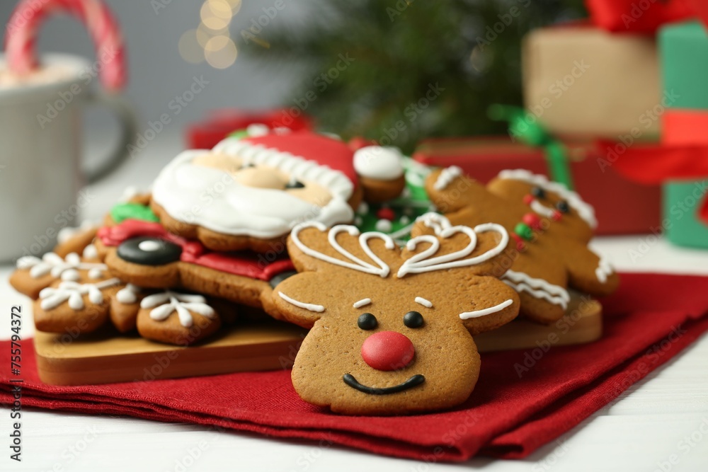 Tasty homemade Christmas cookies on white wooden table, closeup