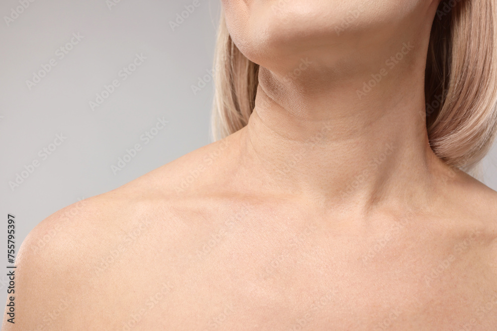 Woman with healthy skin on grey background, closeup Woman with healthy skin on grey background, closeup
