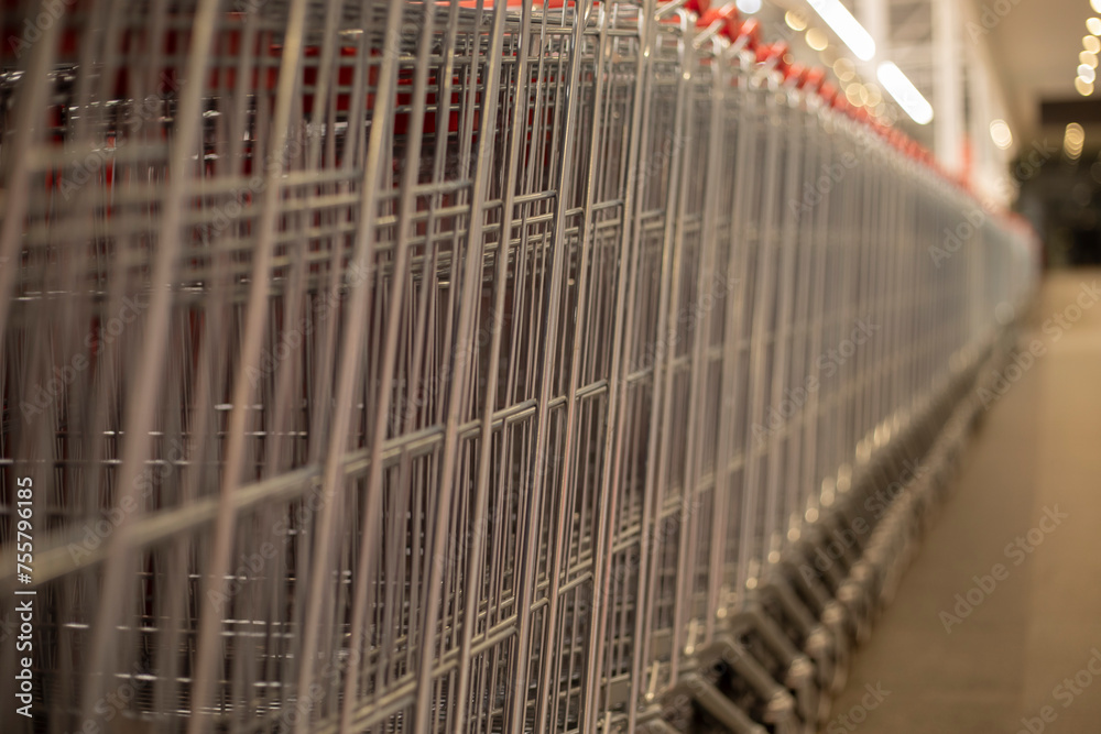 Shopping baskets stand in a row. Grocery basket in a supermarket.