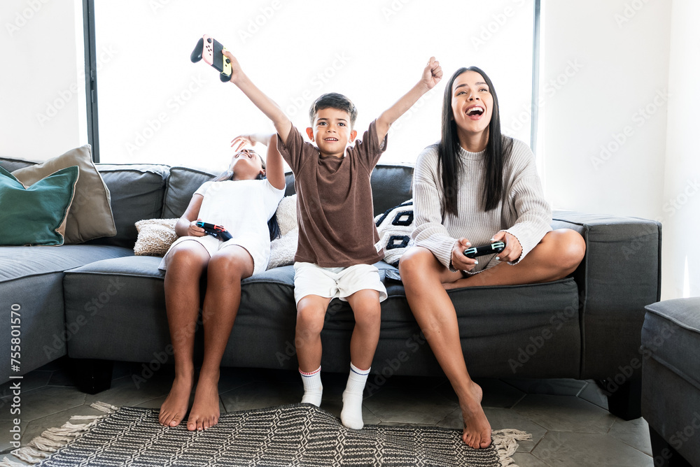 © Carlos Flores - Excited Boy Celebrates Video Game Victory, Beats Sister and Mom, Mexican Family, Entertainment © Carlos Flores - Excited Boy Celebrates Video Game Victory, Beats Sister and Mom, Mexican Family, Entertainment
