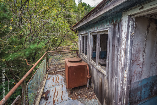 Deck of sinking boat on a Yanov backwater in Pripyat abandoned city in Chernobyl Exclusion Zone, Ukraine