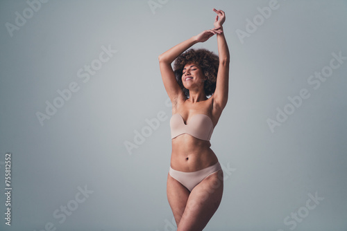 Unretouched photo of body positive girl raise hands enjoy buy new women lingerie isolated pastel color background © deagreez