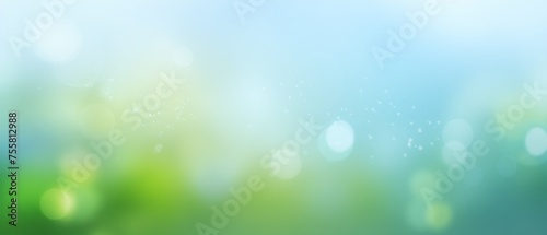 sunny spring bokeh background with green and blue sky