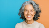 Senior Woman's Radiant Smile isolated on a colorful studio background with copy space