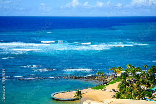 Tropical seascape aerial landscape in San Juan, Puerto Rico over La Poza del Escambrón Beach and Escambron Beach