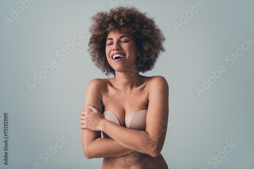 Unretouched photo of lovely girl hug herself laughing enjoy love body curves isolated over pastel color background