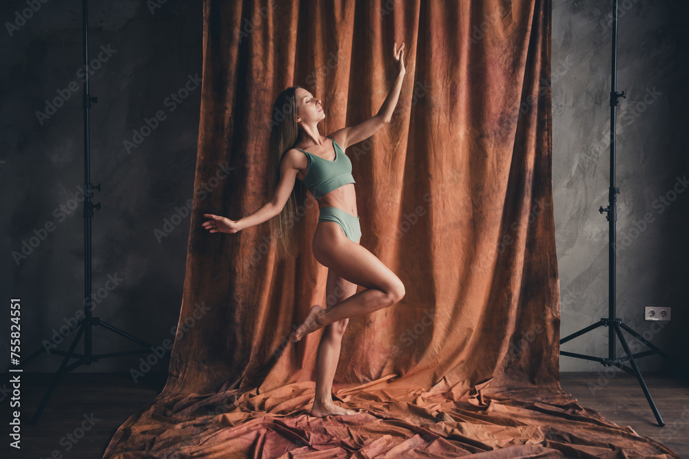 Full length body photo of beautiful sensual lady in khaki brassiere and panties daydreaming pleasure daylight over brown color background Full length body photo of beautiful sensual lady in khaki brassiere and panties daydreaming pleasure daylight over brown color background