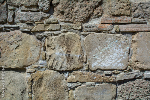 Obraz na płótnie Close-up of a brown stone wall. Background image with copy space w salonie