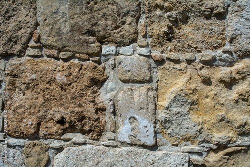 Obraz na płótnie Close-up of a brown stone wall. Background image with copy space w salonie